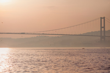 Fototapeta na wymiar Bosporus bridge connecting banks of Bosporus channel in Istanbul, Turkey.