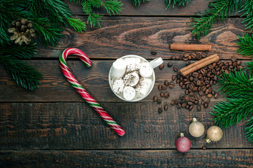 Hot coffee on christmas decorations. Top view