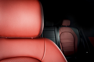 Obraz premium Details of red leather seat in modern sport car