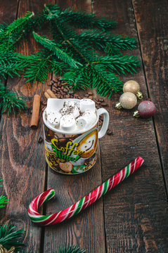 Coffee with marshmallow on christmas background
