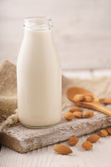 Almond milk, nuts, napkin on a stand