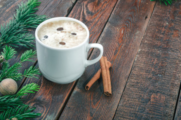 Coffee and cinnamon on christmas background