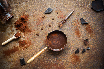 Homemade hot chocolate on rustic background. Making chocolate. Overhead view.