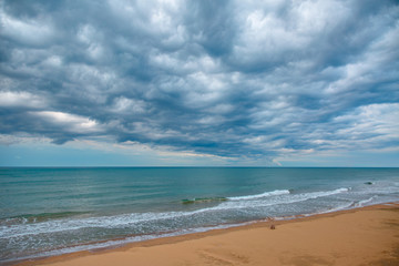 Fototapeta na wymiar Beach with coming nearer thunder-storm