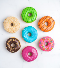 Set of Tasty donuts on white background