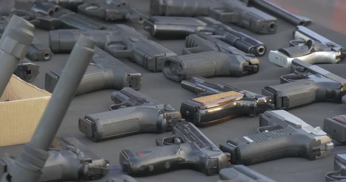 Exhibits of a Museum of Fire-Arms Lie on a Table