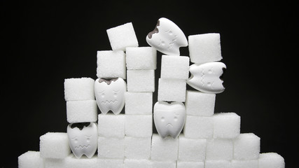 Heap of a lot of cubes sugar and decayed tooth in bad and sad emotion 3 