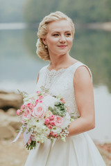 bride with peony and roses wedding bouquet