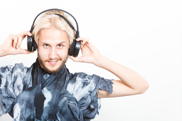 cool guy having fun listens to music in headphones