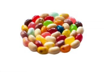 Colorful jelly beans isolated over white background.