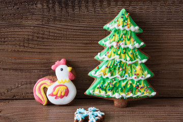 Christmas gingerbread on a brown wooden background