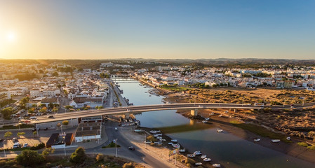 Aerial. Panorama from air bridge across the river town of Tavira.