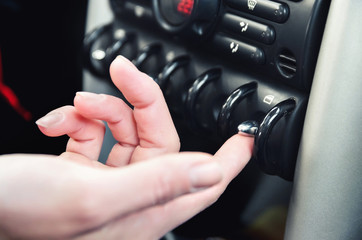 Closeup inside vehicle of hand button