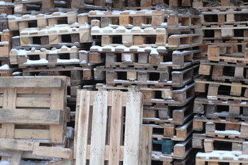 Several pallets near the store in winter.