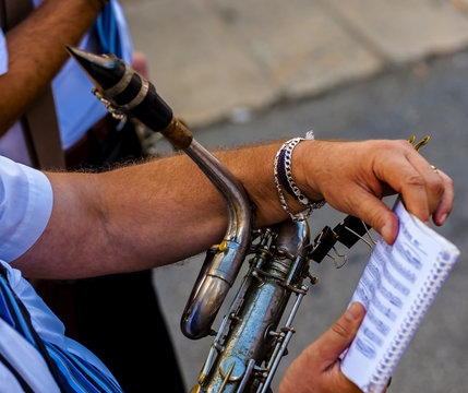 musician plays the clarinet during a religious procession