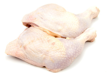 Raw chicken  drumsticks isolated on white.