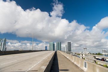 highway with skyscrapers on sky
