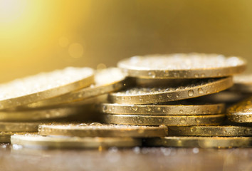 Golden coins closeup - money savings concept