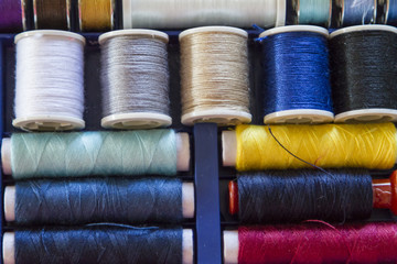 Travel sewing kit including thread spools of many different colo