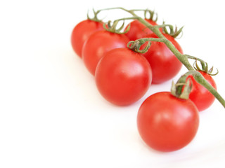 red tomatoes isolated on the white