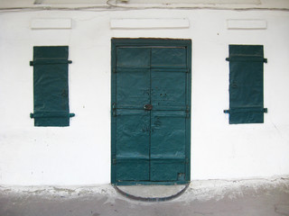 ancient green doors and small windows