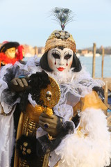 Venice Carnival masked man with mirror