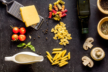 ingredients for cooking paste on dark background top view
