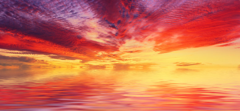 Amazing colorful sea sunset landscape with fantactic colors in the sky and reflection in the water. Beauty world natural outdoors travel background