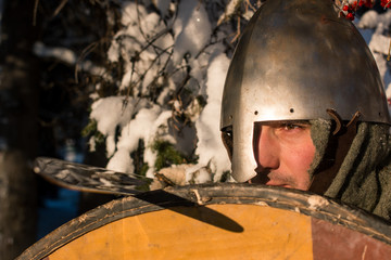 Portrait of a medieval warrior with sword and shield