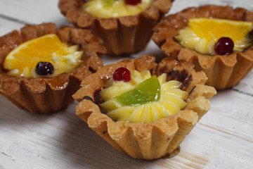 Homemade cake on a wooden background. View from above. Sweet dessert. Closeup cake