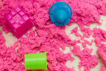 Kinetic Sand In A Heap For Indoor Game Or Children Creativity. Forms for the construction of the...