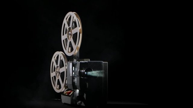 On the background of a working film projector smoke