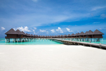 beach with water bungalows at Maldives