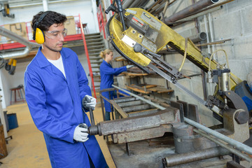 worker tending a machine