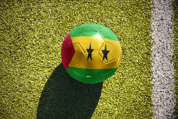 football ball with the national flag of sao tome and principe lies on the field
