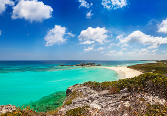 Fototapeta na wymiar Dragon Cay at low tide viewed from the cliffs above, with the rocks mostly exposed. Mudjin Harbor, Middle Caicos