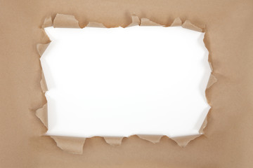 Fototapeta premium Torn thick brown paper frame. Clipping paths for interior and paper curls. Clip interior on layer set to multiply for shadow on pasted content.