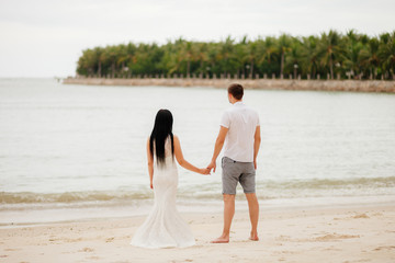 Fototapeta na wymiar honeymoon couple relax on beach