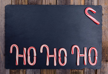 Holiday striped candy cane Ho-Ho-Ho text