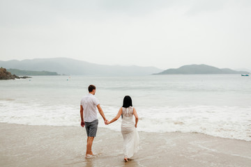 Fototapeta na wymiar honeymoon couple relax on beach