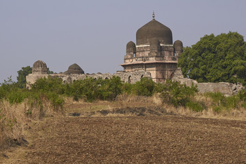 Darya Khan's tomb in the hilltop fortress of Mandu. Building with central dome and a smaller dome...