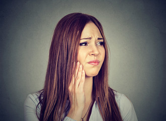 woman with sensitive toothache about to cry from pain