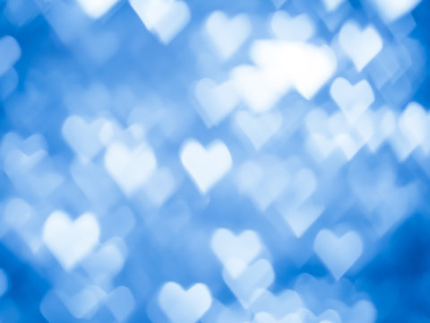 Blue heart bokeh Christmas light holiday background.