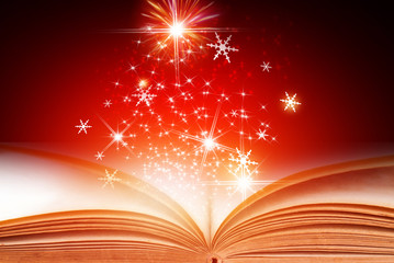 Open book with abstract red Christmas background