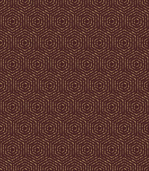 Geometric repeating ornament with hexagonal dotted elements. Seamless abstract modern pattern. Brown and golden pattern