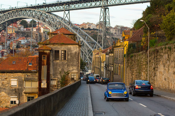 One of the streets of Villa Nova de Gaia and Dom Luis I bridge, Porto, Portugal.