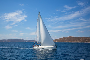Naklejka premium Luxury yacht at regatta. Sailing in the wind through the waves at the Aegean Sea.