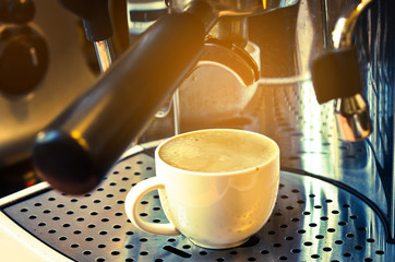 Professional coffee machine making espresso.