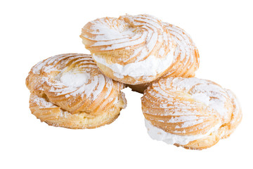 creamy cakes made of puff pastry isolated on white
