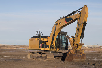 Excavator on a Construction Site in the Evening